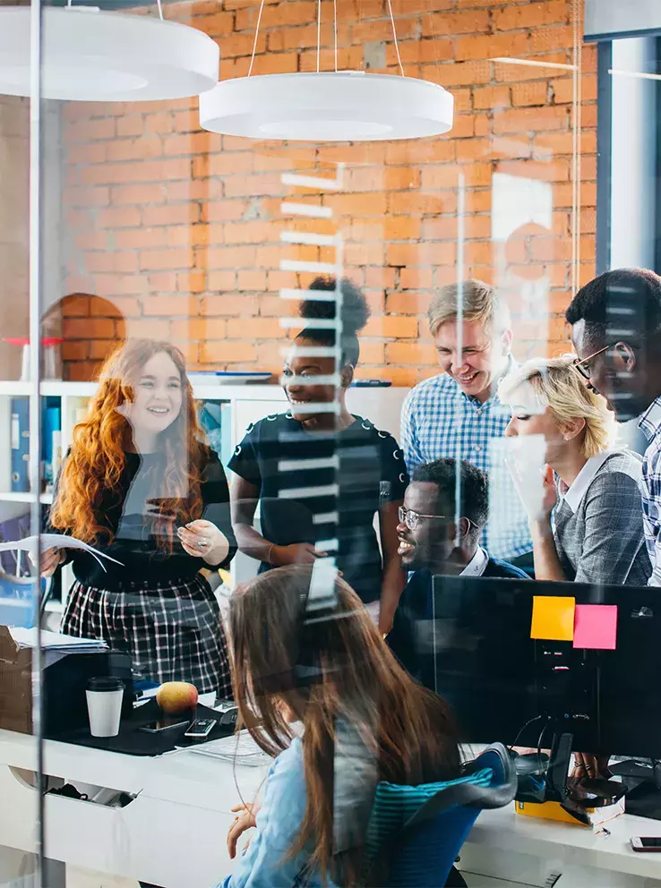 Group of energetic office workers in a morning meeting