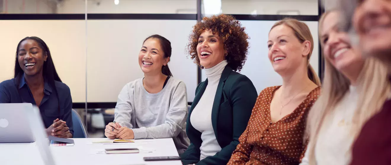 Group of women around a conference table